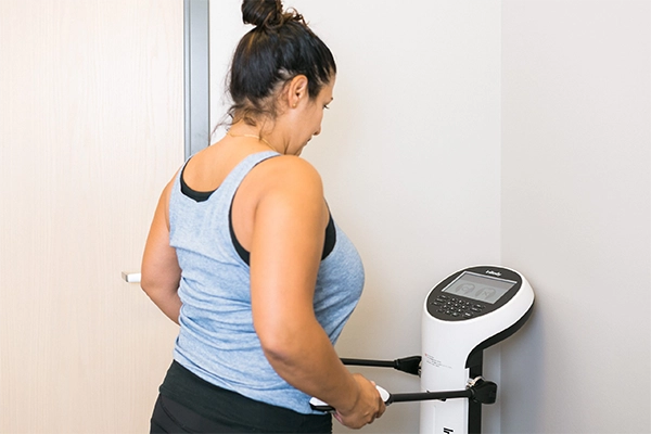 Weight Loss St. Louis MO Woman On Machine