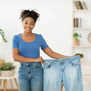 Weight Loss St. Louis MO Lady Holding Her Old Pants